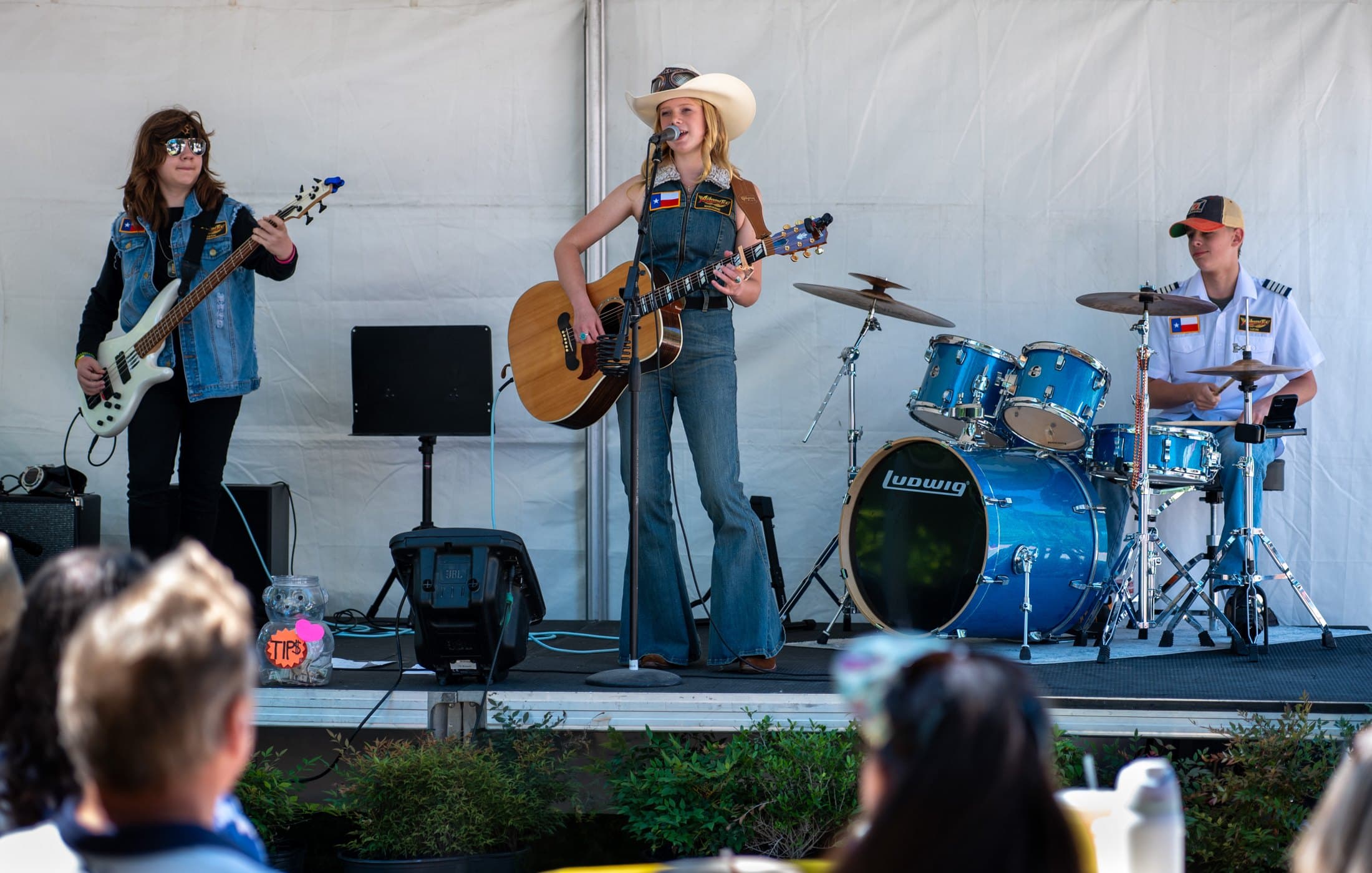 Airbourne Tex plays the Cottonwood Art Festival in Richardson on May 3, 2026. From left: Jaxton Weatherly, Maryanne Hilton and Lucas Rehl. Photo: Zoe Trewin